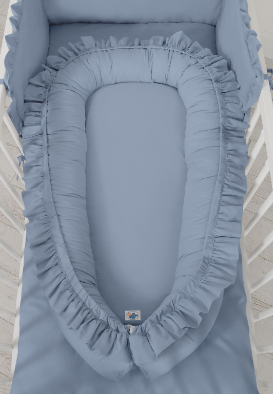 Cocoon baby nest with a ruffle – pastel blue