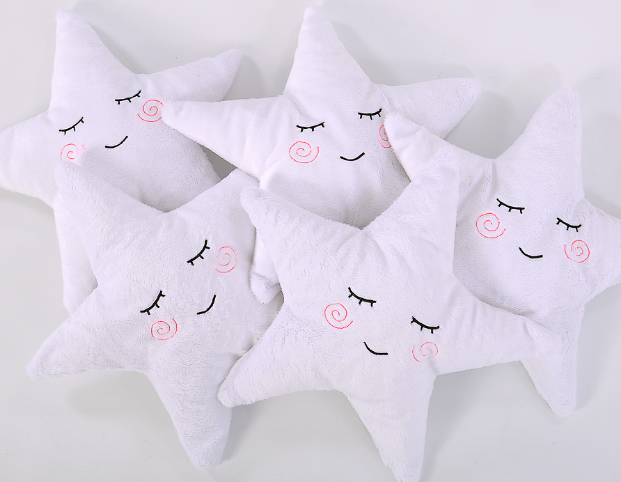 Star-shaped cuddle pillow with a rattle – white